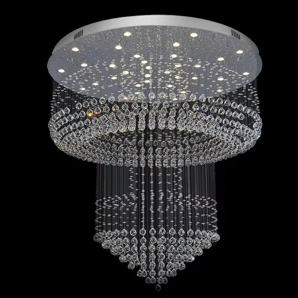 This is a multi-layered cascading crystal ceiling light, composed of numerous stacked crystal beads and components. It has a three-dimensional and layered shape, translucent and brilliant under light. It is used for space lighting and luxurious decoration, combining practicality and artistry to significantly enhance the space’s grade. It is suitable for high-end hotel lobbies, luxury villa living rooms, large banquet halls and other high-end places.