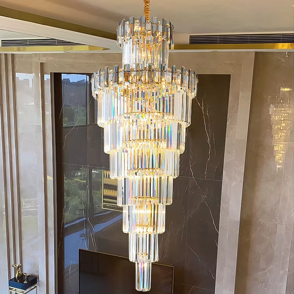 Luxurious multi-layer column crystal tower chandelier, golden frame paired with transparent long crystals, layered decreasing shape, brilliant and gorgeous lighting, creating a high-end luxurious atmosphere.