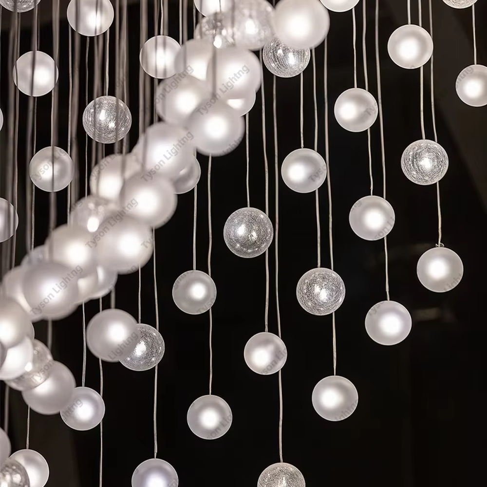 This is a modern artistic spherical light cluster chandelier with numerous white spherical lights arranged in a creative cluster via hanging wires. It features a highly immersive and artistic design with a futuristic ambiance. It is used for space lighting and decoration, creating a stunning visual focus and immersive light-shadow atmosphere. It is suitable for atriums of large commercial complexes, lobbies of high-end hotels, art galleries and exhibition halls and other places.