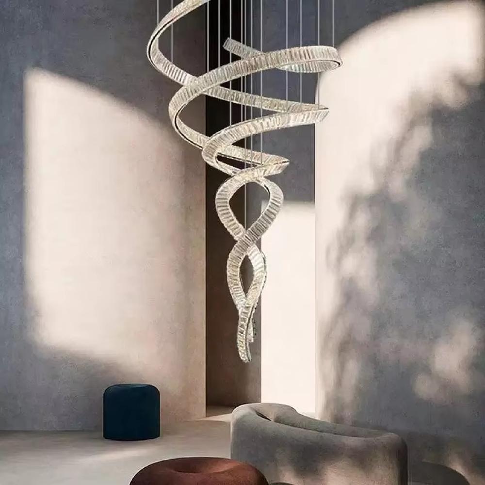 This is a luxury spiral crystal chandelier with winding crystal light strips, featuring a modern and artistic design with high-end luxury ambiance. It is used for space lighting and decoration, creating a stunning visual focus and opulent atmosphere. It is suitable for villa double-height living rooms, high-end hotel lobbies, art exhibition halls and other places.