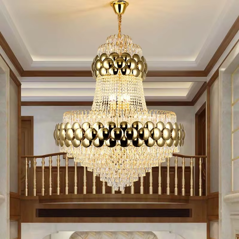 This is a luxurious multi-layer golden ball crystal chandelier, featuring a multi-layer structure combining golden metal balls and crystals. When lit, the light is brilliant and gorgeous, creating a high-end luxurious space atmosphere.
