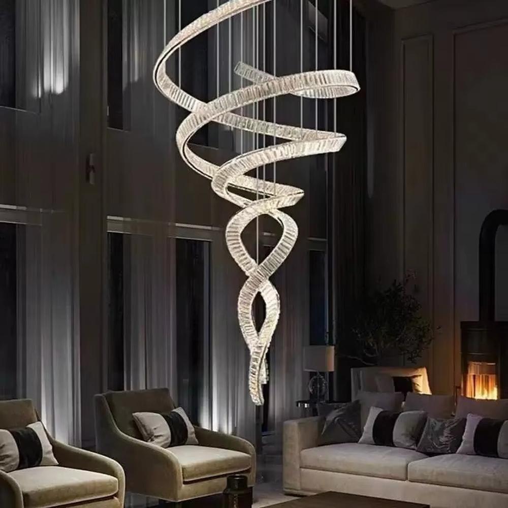 This is a luxury spiral crystal chandelier with winding crystal light strips, featuring a modern and artistic design with high-end luxury ambiance. It is used for space lighting and decoration, creating a stunning visual focus and opulent atmosphere. It is suitable for villa double-height living rooms, high-end hotel lobbies, art exhibition halls and other places.