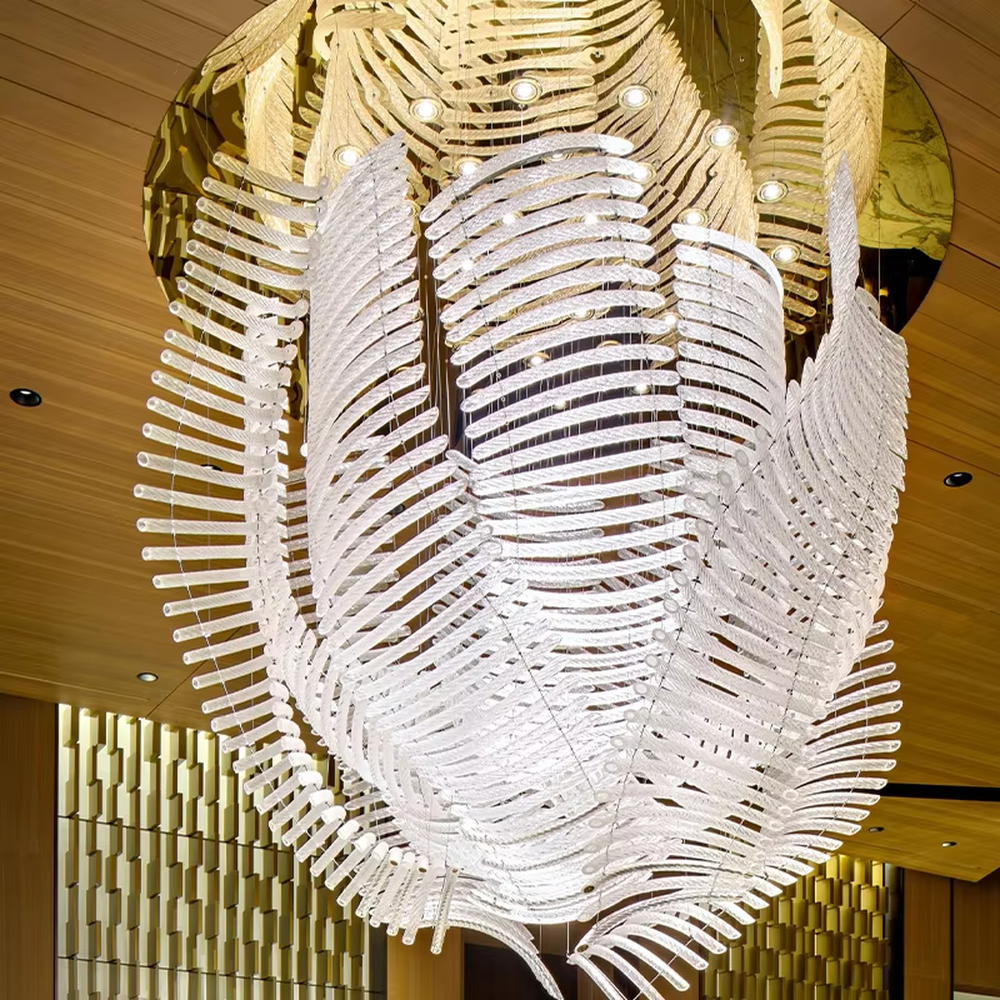 This is an artistic installation-style white leaf-shaped chandelier, with numerous white leaf-shaped elements (similar to feathers or fern leaves) hanging in a scattered manner by thin wires to form a three-dimensional layer. It features soft lighting and a strong sense of modern art and spatial tension. It is used for space lighting and artistic decoration, creating a modern artistic and ethereal atmosphere. Suitable for high-end hotel lobbies, art exhibition halls, high-ceiling spaces in luxury villas and other places.