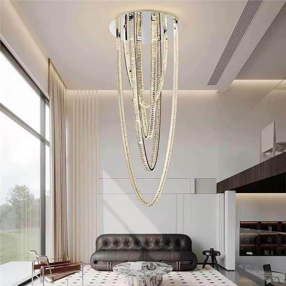 This is a modern artistic chain chandelier with a multi-layered golden chain design, unique and layered, showing a luxurious artistic sense. It is used for space lighting and decoration, enhancing the luxurious artistic atmosphere of the space. It is suitable for high-ceiling villa living rooms, high-end hotel lobbies, art spaces and other places.