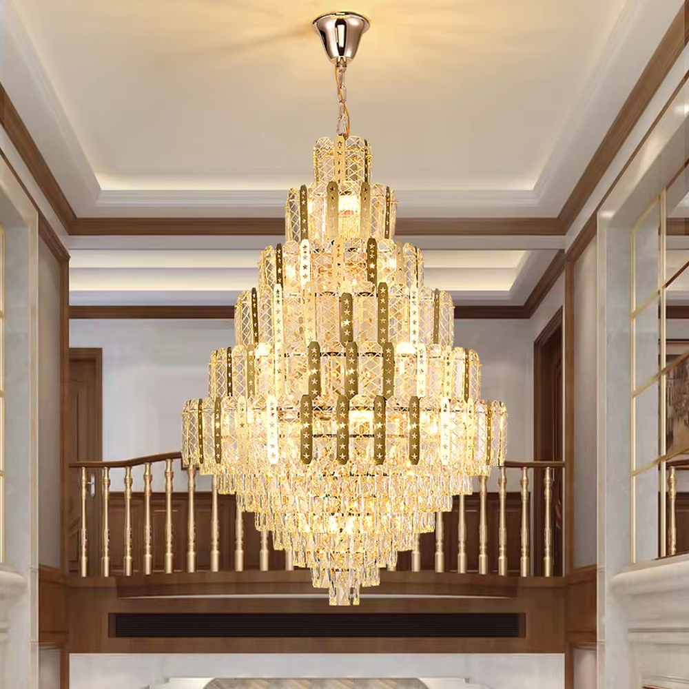 This is a luxurious multi-layer crystal frame chandelier, with a golden metal frame paired with transparent crystals in a layered tower shape. When lit, the light is brilliant and gorgeous, creating a high-end luxurious atmosphere.