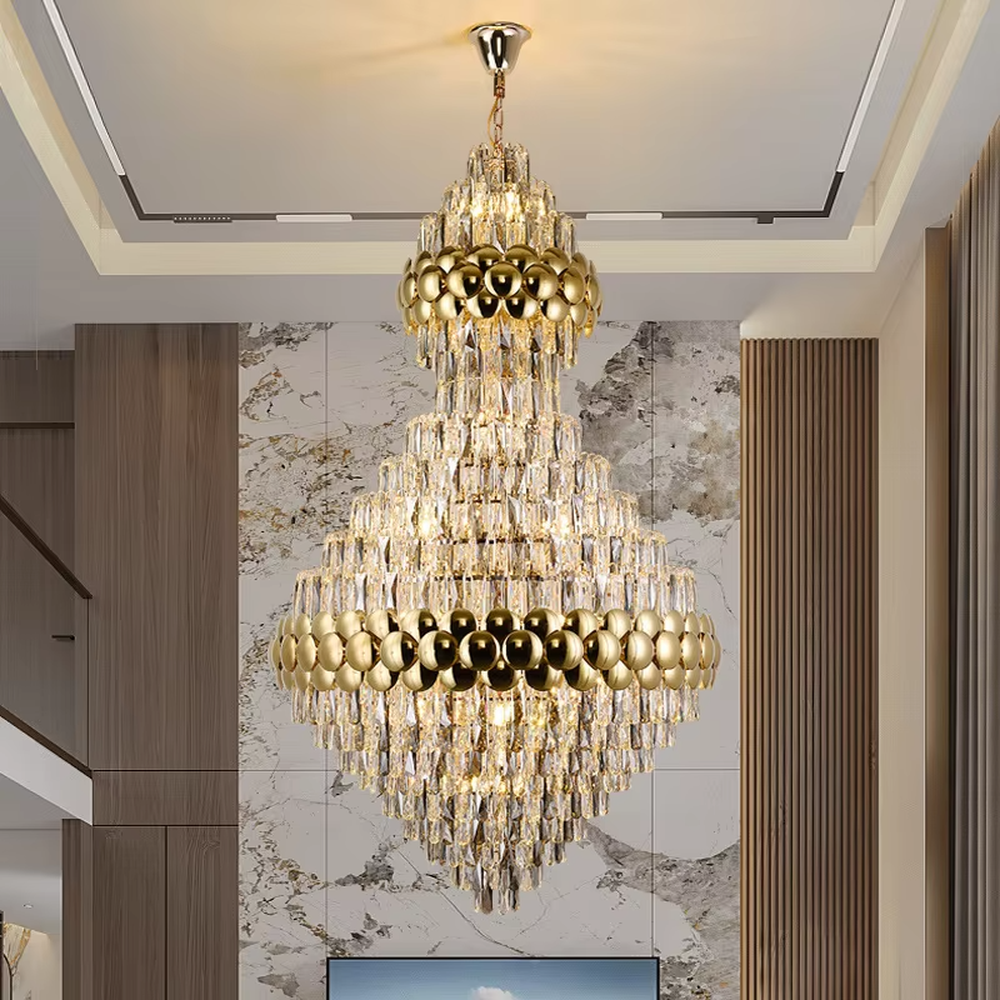 This is a luxurious double-layer crystal golden ball chandelier, featuring a golden metal frame paired with transparent crystals and golden spherical decorations, with a double-layer hierarchical design. It has a magnificent and grand style, with brilliant and soft lighting, creating a high-end luxurious atmosphere.