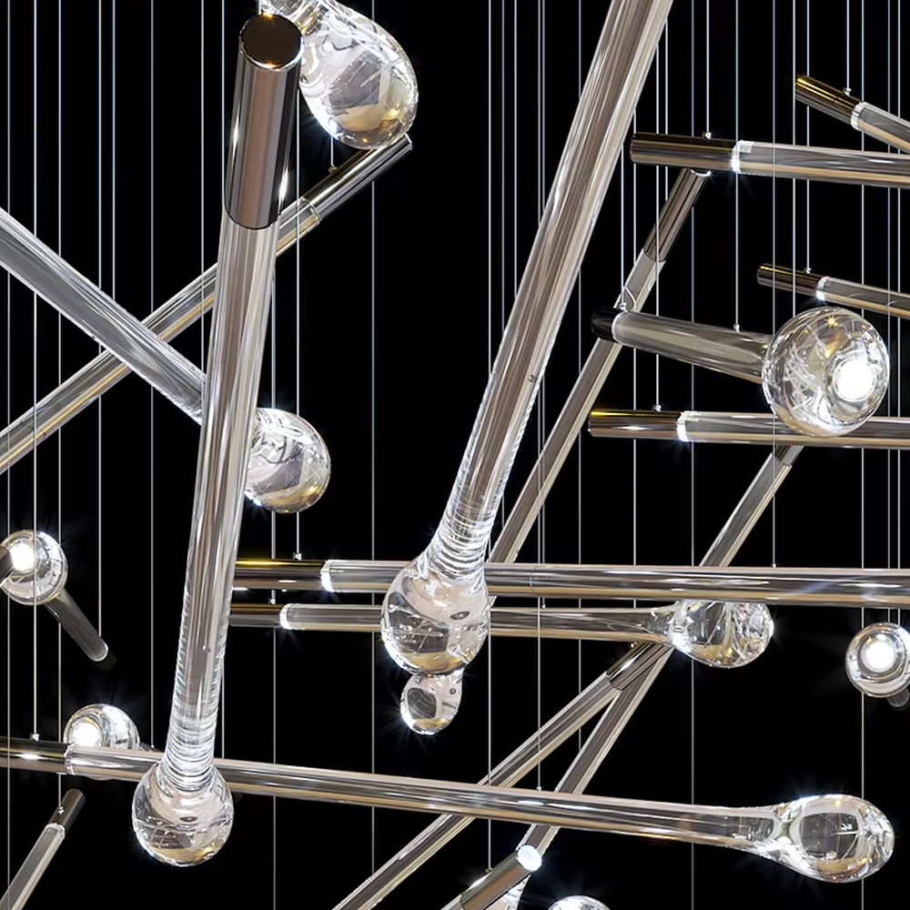 This is a modern artistic transparent crystal rod staggered hanging chandelier, with silver metal slender rods paired with crystal ends, multiple rods staggered and hung. When the lights are on, it is brilliant and dreamy, creating a highly artistic space atmosphere.