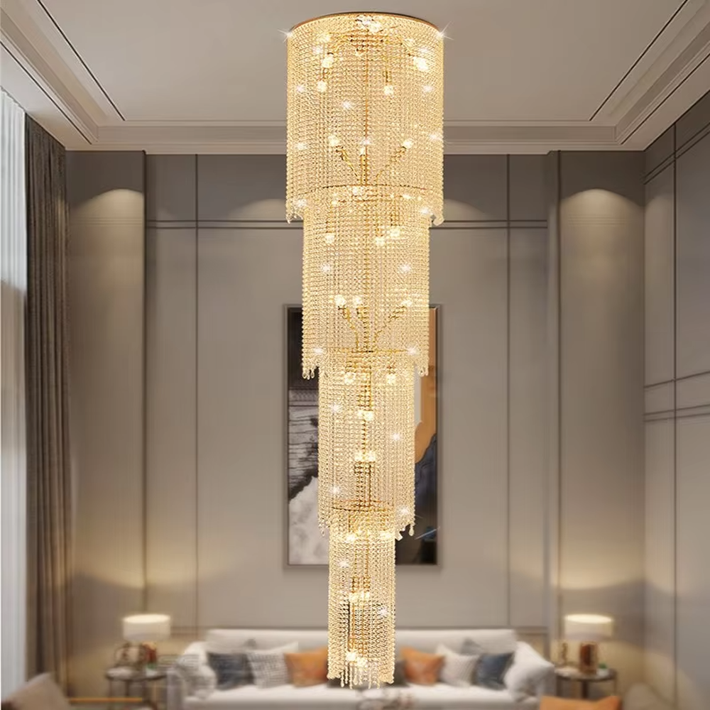 This is a luxury multi-layer cylindrical crystal chandelier, with a golden metal frame and multi-layer transparent crystal pendants, brilliant lighting, featuring a magnificent and grand design with strong visual impact. It is used for space lighting and decoration, creating a high-end luxury atmosphere. It is suitable for duplex stairwells, high-ceilinged living rooms, high-end hotel lobbies and other places.