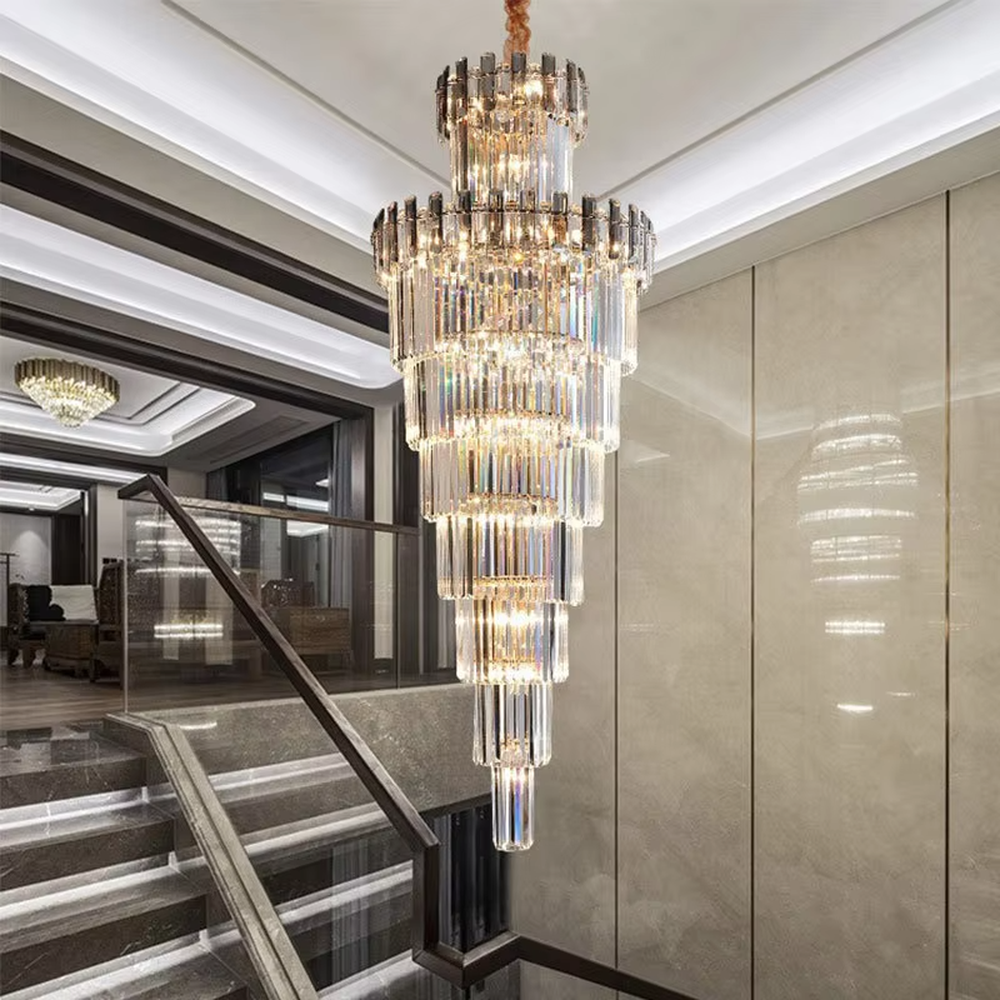 Luxurious multi-layer column crystal tower chandelier, golden frame paired with transparent long crystals, layered decreasing shape, brilliant and gorgeous lighting, creating a high-end luxurious atmosphere.