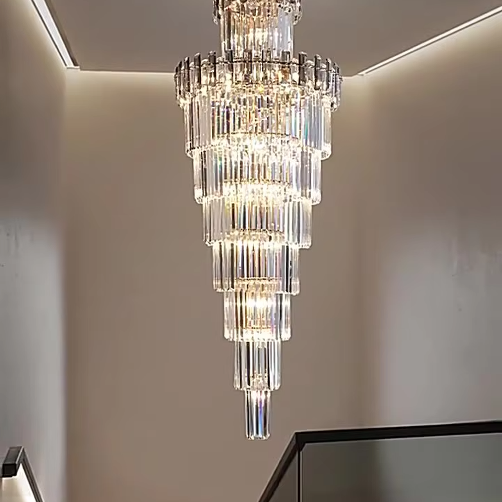 Luxurious multi-layer column crystal tower chandelier, golden frame paired with transparent long crystals, layered decreasing shape, brilliant and gorgeous lighting, creating a high-end luxurious atmosphere.