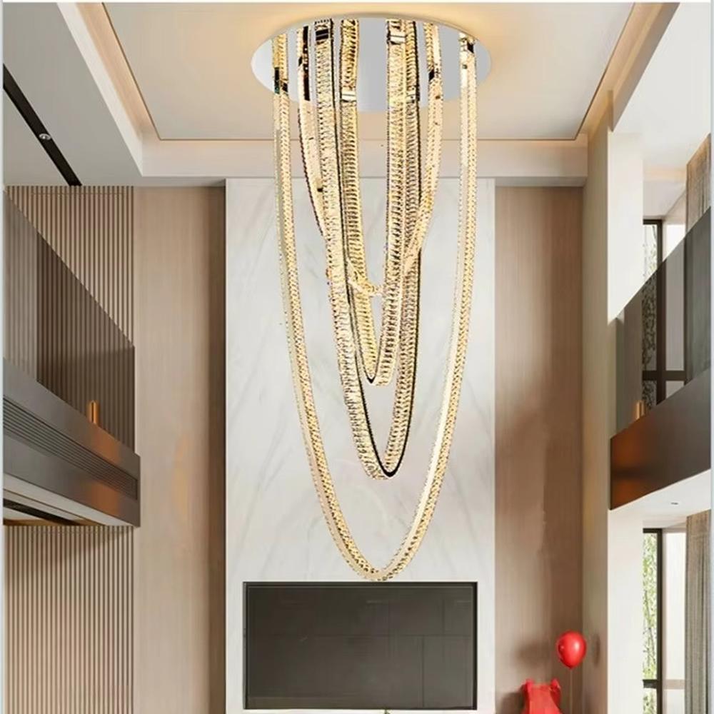 This is a modern artistic chain chandelier with a multi-layered golden chain design, unique and layered, showing a luxurious artistic sense. It is used for space lighting and decoration, enhancing the luxurious artistic atmosphere of the space. It is suitable for high-ceiling villa living rooms, high-end hotel lobbies, art spaces and other places.