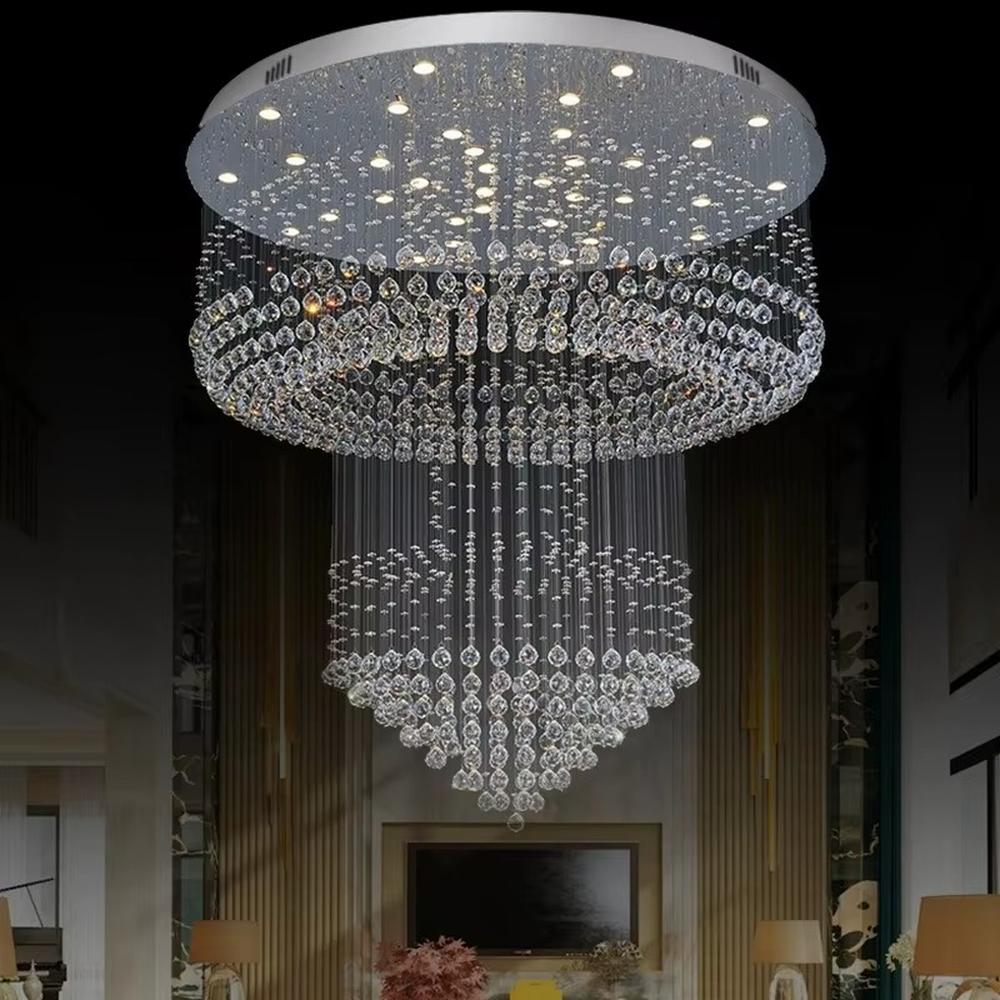 This is a multi-layered cascading crystal ceiling light, composed of numerous stacked crystal beads and components. It has a three-dimensional and layered shape, translucent and brilliant under light. It is used for space lighting and luxurious decoration, combining practicality and artistry to significantly enhance the space’s grade. It is suitable for high-end hotel lobbies, luxury villa living rooms, large banquet halls and other high-end places.