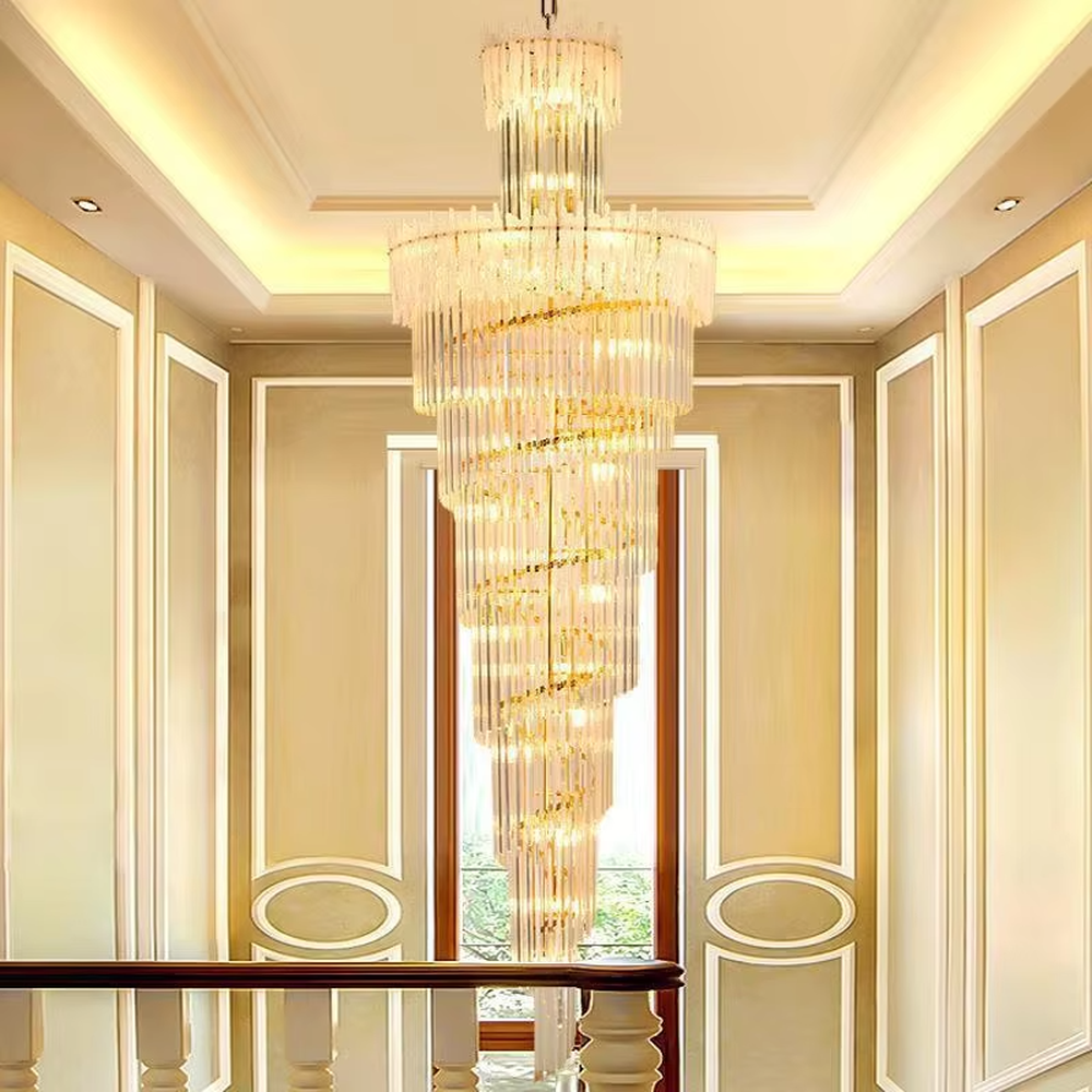 This is a modern luxurious large spiral crystal chandelier, with a golden metal frame paired with transparent crystal strips arranged in multiple spirals. It features a strong sense of spatial depth and artistry, with brilliant and grand lighting. It is used for space lighting and artistic decoration, creating a luxurious and high-end atmosphere. Suitable for high-ceiling lobbies of high-end hotels, double-height living rooms in luxury villas, large commercial clubs and other places.