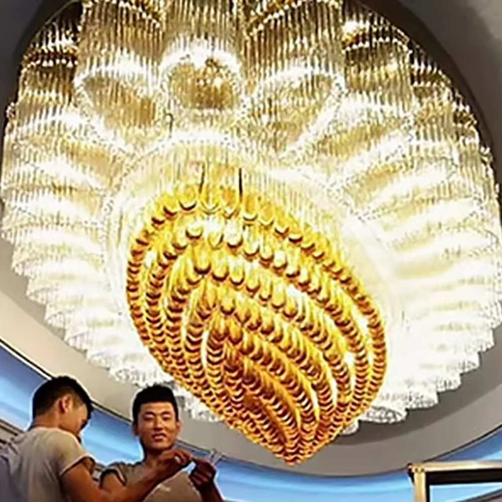 This is an artistic turquoise glass chandelier, with multi-layer turquoise glass components in an irregular hanging shape, transparent and brilliant texture, featuring extremely artistic and luxurious design. It is used for space lighting and decoration, creating a high-end artistic luxury atmosphere. It is suitable for high-end hotel lobbies, luxury banquet halls, art exhibition halls and other places.