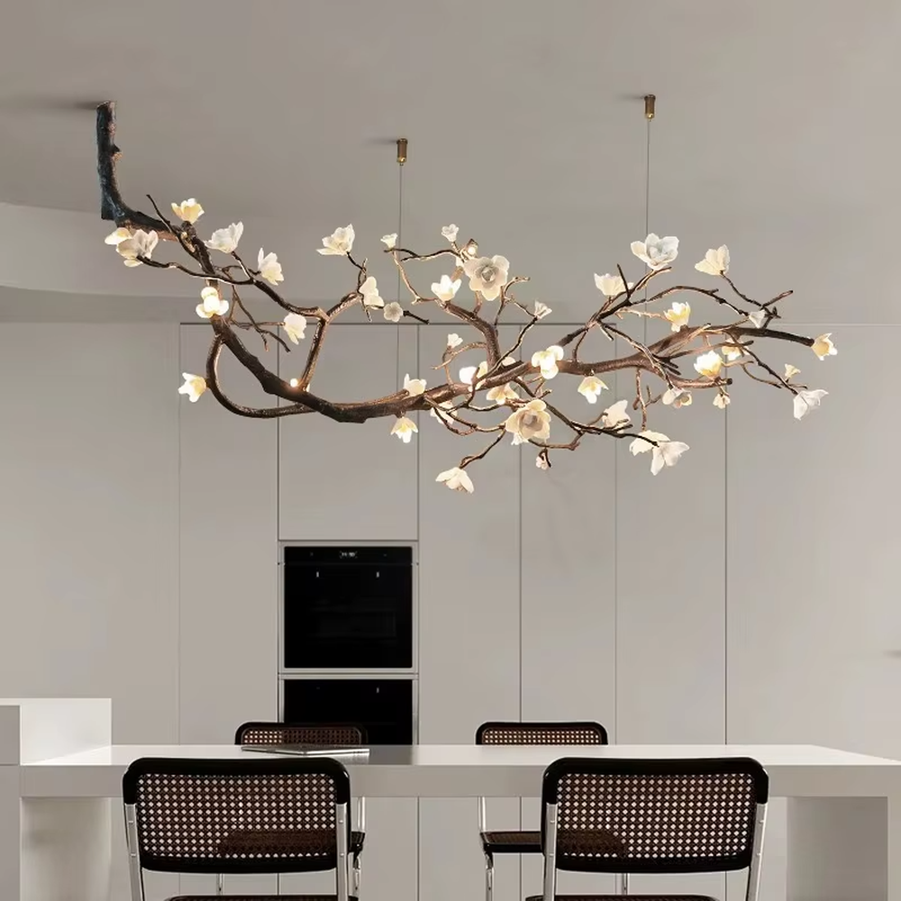 This is a natural artistic flower branch chandelier, with metal branches and white flower shapes, featuring a strong natural artistic sense and elegant fresh style. It is used for space lighting and decoration, creating a natural artistic atmosphere. It is suitable for new Chinese-style home restaurants, homestay leisure areas, artistic-style living rooms and other places.