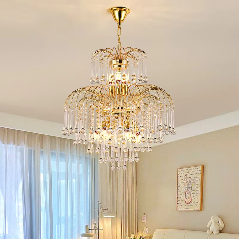 This is a luxurious classical golden multi-layer crystal chandelier, with a golden metal frame paired with numerous transparent crystal pendants. It features a magnificent and grand design, with brilliant lighting. It is used for space lighting and decoration, creating a luxurious and noble atmosphere. Suitable for luxury living rooms, high-end hotel lobbies, villa banquet halls and other places.