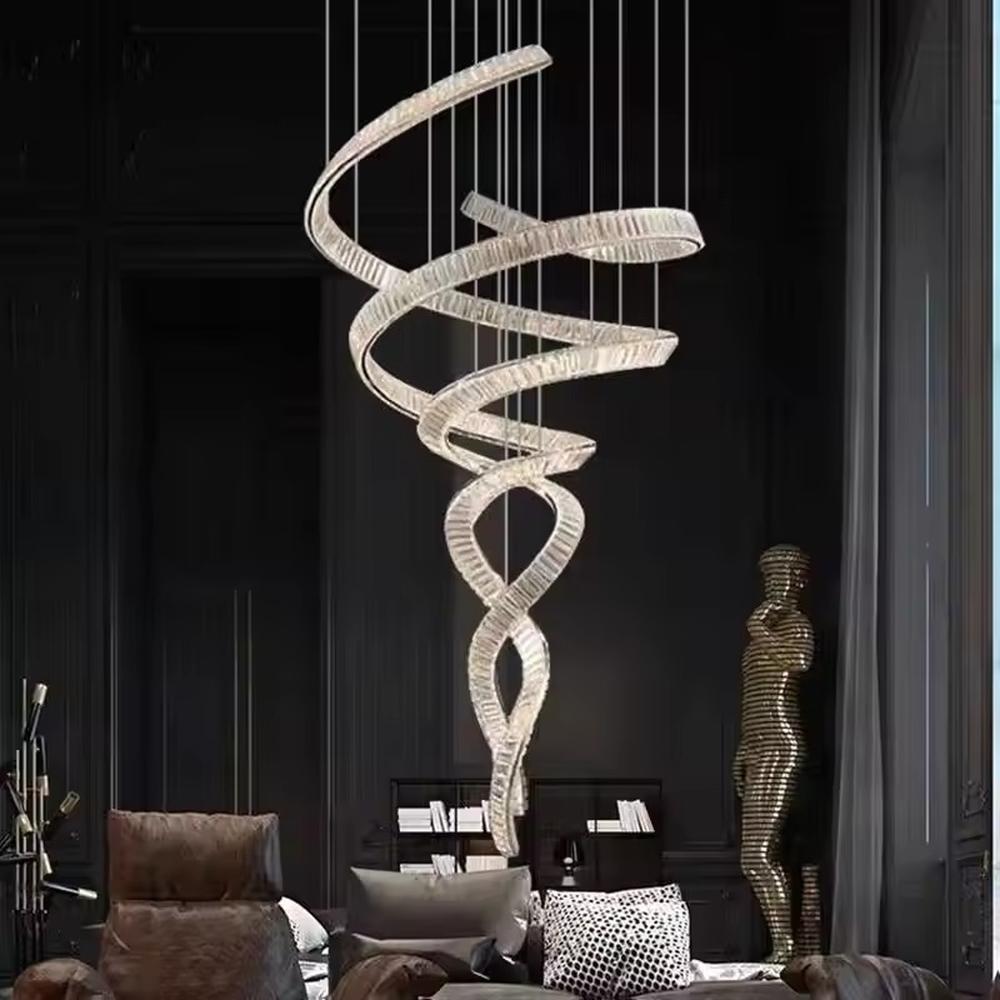 This is a luxury spiral crystal chandelier with winding crystal light strips, featuring a modern and artistic design with high-end luxury ambiance. It is used for space lighting and decoration, creating a stunning visual focus and opulent atmosphere. It is suitable for villa double-height living rooms, high-end hotel lobbies, art exhibition halls and other places.