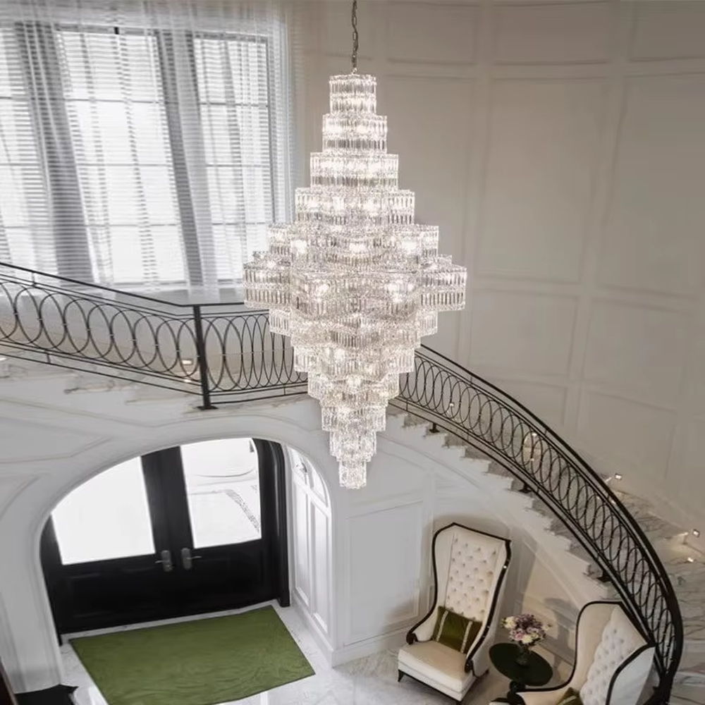 This is a luxury multi-layer pagoda-shaped crystal chandelier, with transparent crystal components in a multi-layer pagoda shape, brilliant lighting, featuring a magnificent and luxurious design with strong visual impact. It is used for space lighting and decoration, creating a high-end luxury atmosphere. It is suitable for high-end hotel lobbies, luxury villa high-ceilinged living rooms, large commercial exhibition halls and other places.