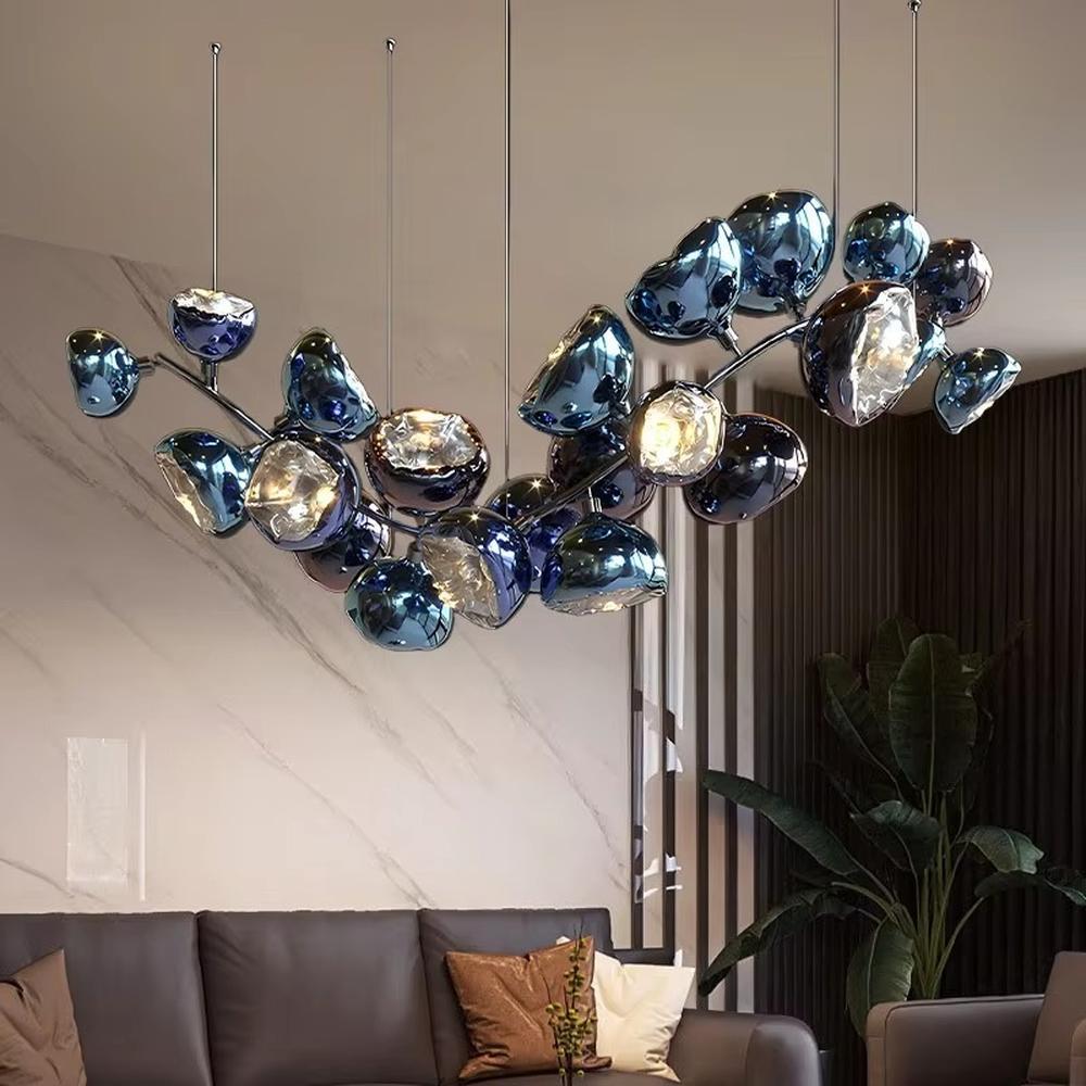 This is an artistic gem-shaped chandelier with blue-black metallic gem-like lampshades distributed in a branch-like structure, featuring a modern artistic design with strong luxury sense. It is used for space lighting and decoration, creating a modern artistic luxury atmosphere. It is suitable for modern luxury home living rooms, high-end commercial exhibition halls, art soft decoration spaces and other places.