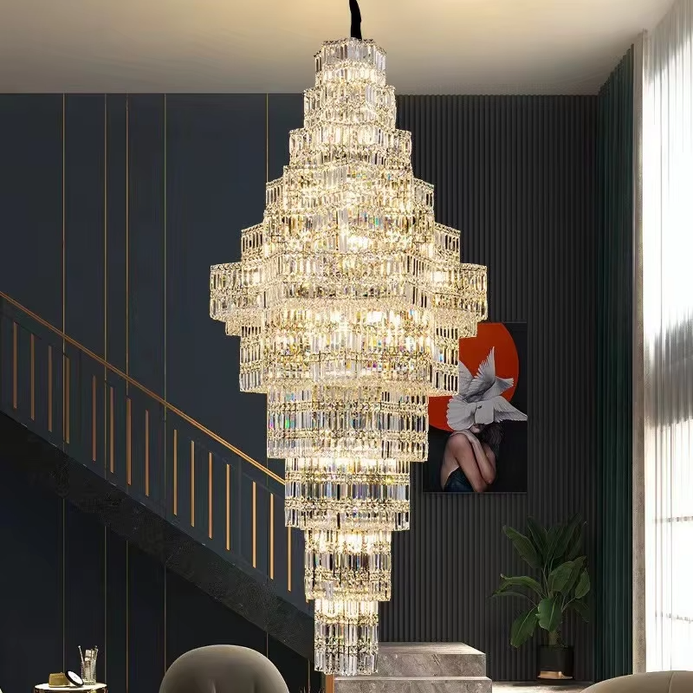 This is a luxury multi-layer pagoda-shaped crystal chandelier, with transparent crystal components in a multi-layer pagoda shape, brilliant lighting, featuring a magnificent and luxurious design with strong visual impact. It is used for space lighting and decoration, creating a high-end luxury atmosphere. It is suitable for high-end hotel lobbies, luxury villa high-ceilinged living rooms, large commercial exhibition halls and other places.