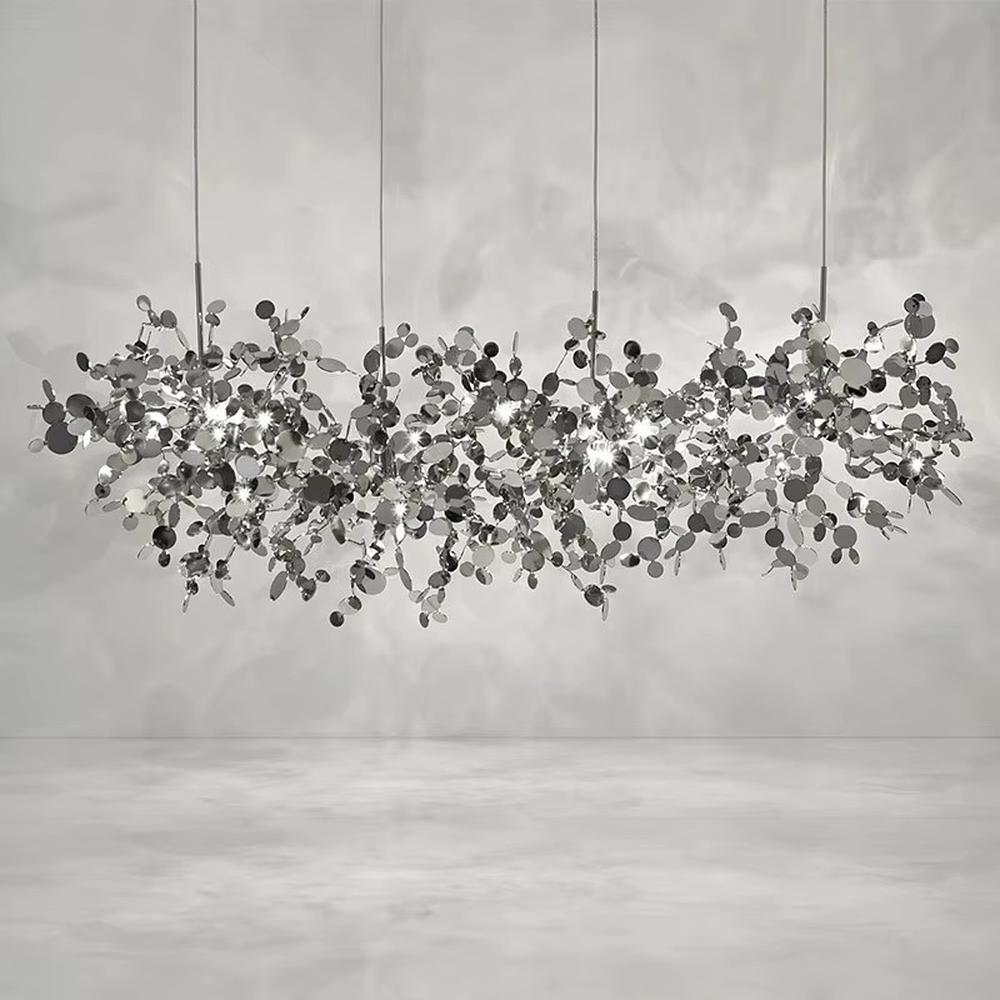 This is an artistic installation-style metal disc chandelier, with numerous metal discs interwoven in a scattered manner, featuring strong artistic sense and modern style, and the light reflects a brilliant visual effect. It is used for space lighting and artistic decoration, creating an artistic and modern atmosphere. It is suitable for art exhibition halls, high-end hotel lobbies, modern art home living rooms and other places.