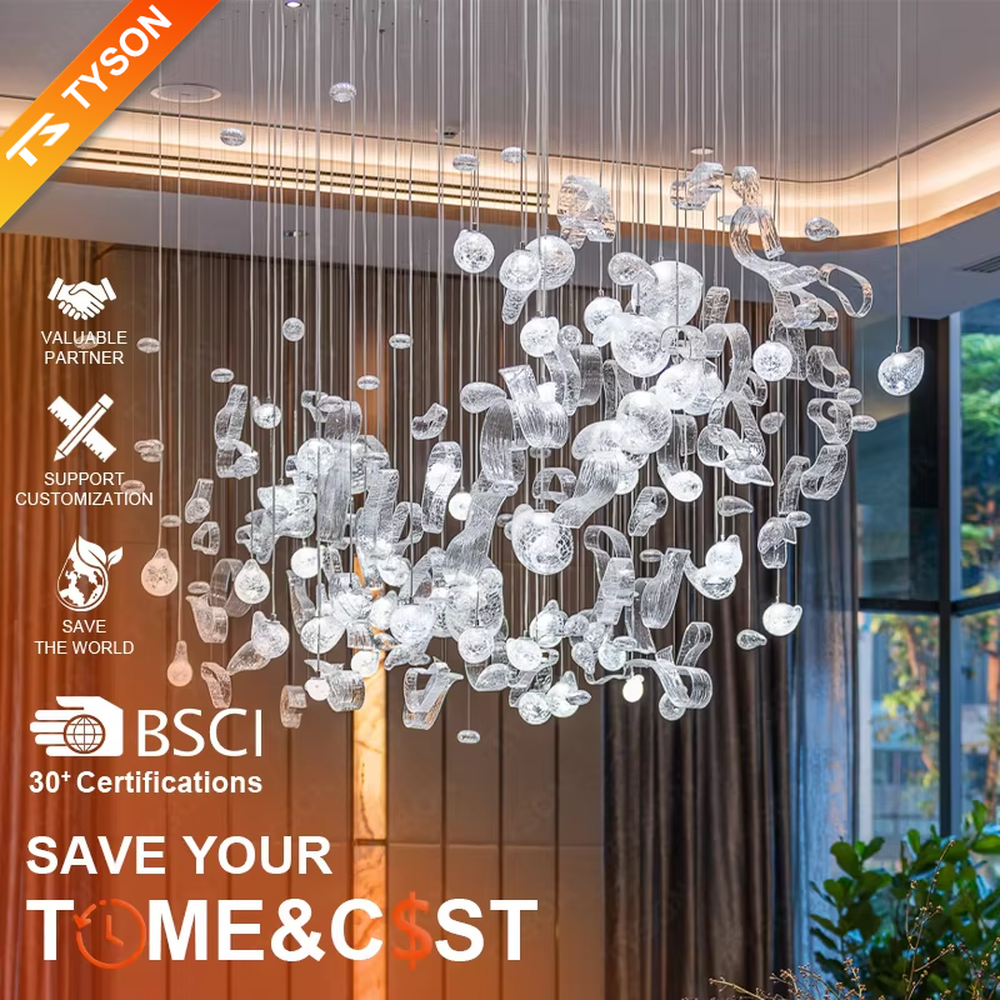 This is an artistic installation-style irregular transparent glass hanging chandelier, composed of numerous irregular transparent glass elements (spherical, block-shaped, etc.) hanging in a scattered manner by thin wires to form a three-dimensional layer. It features soft light refraction and a strong sense of modern art and spatial tension. It is used for space lighting and artistic decoration, creating a modern artistic and ethereal atmosphere. Suitable for high-end hotel lobbies, art exhibition halls, high-ceiling spaces in luxury villas and other places.
