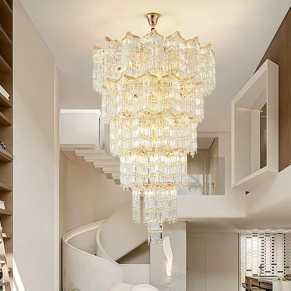 This is a luxury multi-layer conical crystal chandelier, with a golden metal frame and numerous transparent crystal pendants, featuring a magnificent and grand design with brilliant lighting and strong visual impact. It is used for space lighting and decoration, creating a high-end luxury atmosphere. It is suitable for duplex stairwells, high-ceilinged living rooms, high-end hotel lobbies, luxury villas and other places.