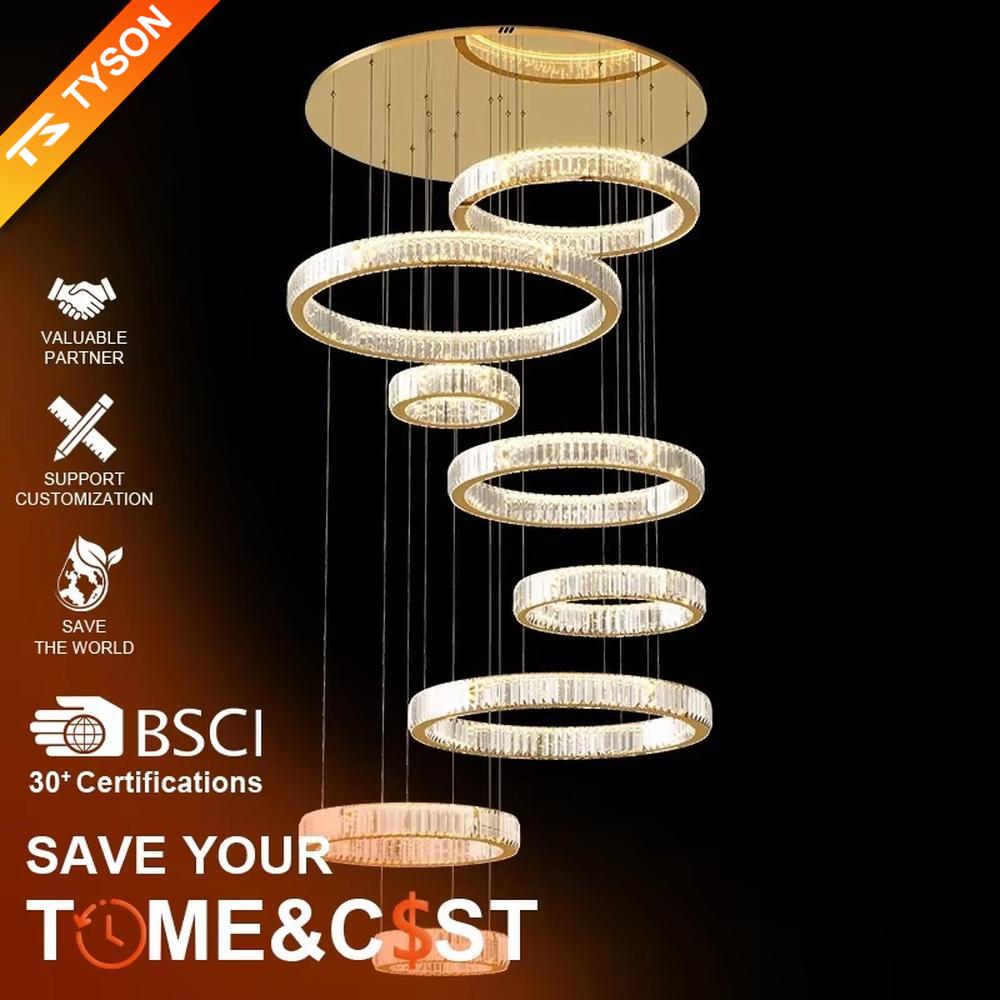 This is a luxury multi-layer circular crystal chandelier, with a golden base and staggered hanging crystal ring lamp bodies. It features a luxurious and grand design, shining brightly under light. It is used for space lighting and decoration, creating a high-end and luxurious ambiance. It is suitable for double-height living rooms in villas, lobbies of high-end hotels, luxury clubs and other places.