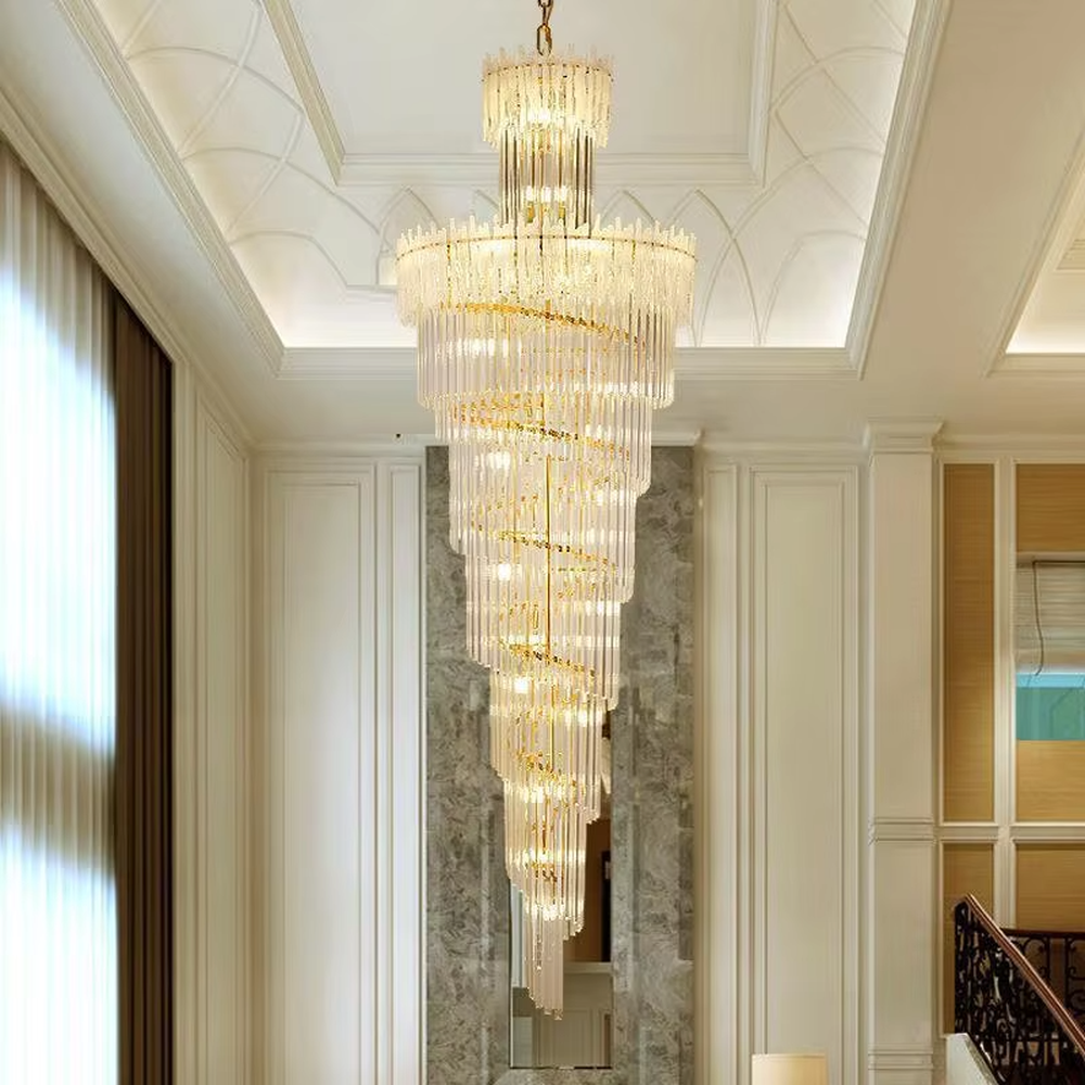 This is a modern luxurious large spiral crystal chandelier, with a golden metal frame paired with transparent crystal strips arranged in multiple spirals. It features a strong sense of spatial depth and artistry, with brilliant and grand lighting. It is used for space lighting and artistic decoration, creating a luxurious and high-end atmosphere. Suitable for high-ceiling lobbies of high-end hotels, double-height living rooms in luxury villas, large commercial clubs and other places.