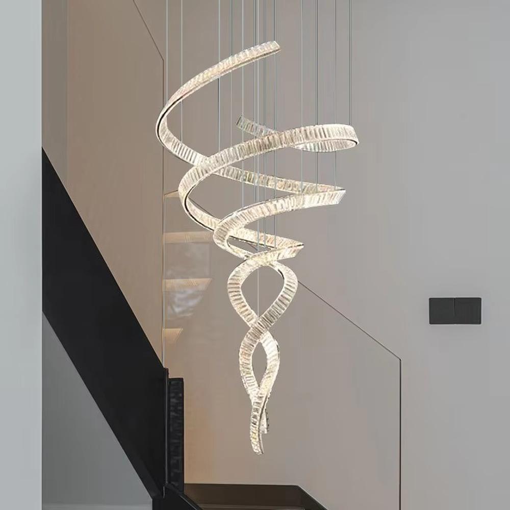 This is a luxury spiral crystal chandelier with winding crystal light strips, featuring a modern and artistic design with high-end luxury ambiance. It is used for space lighting and decoration, creating a stunning visual focus and opulent atmosphere. It is suitable for villa double-height living rooms, high-end hotel lobbies, art exhibition halls and other places.