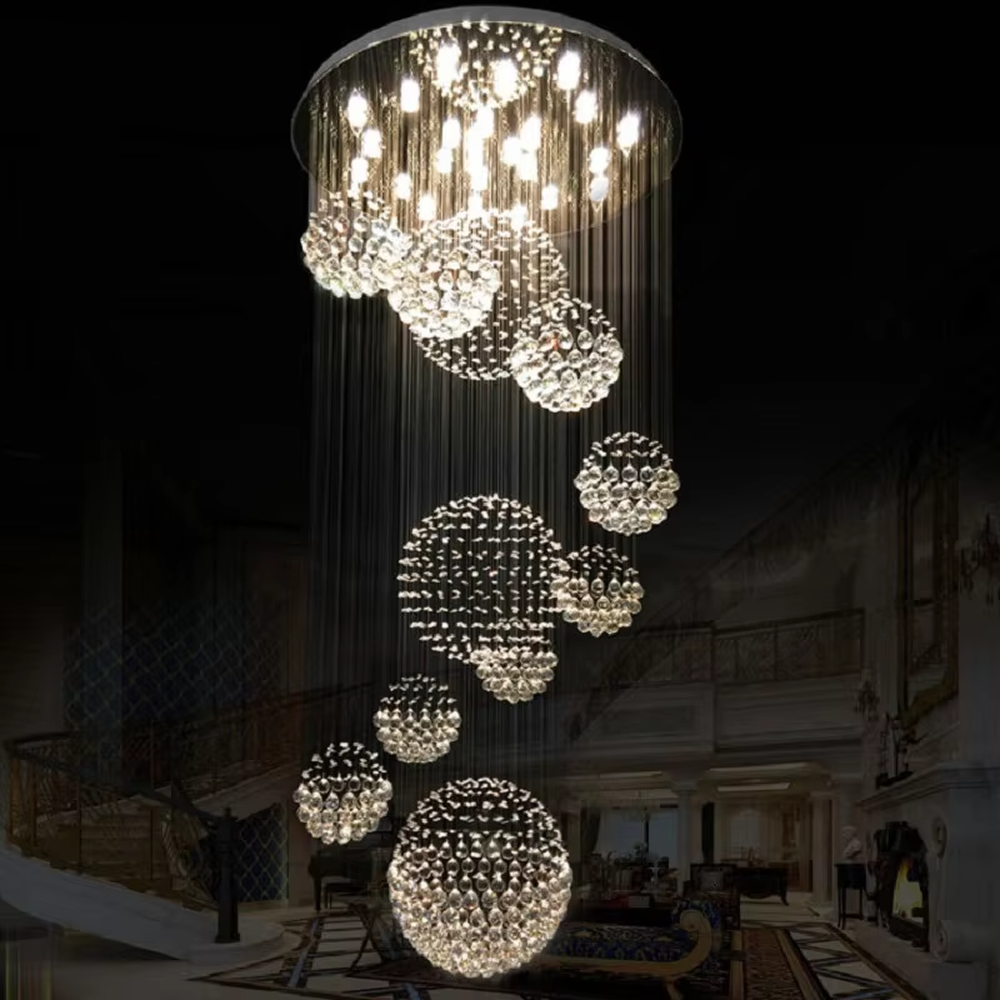 This is a modern luxurious multi-layer spherical crystal chandelier, composed of multiple transparent crystal balls forming spherical structures hung in layers. It features strong artistic sense and spatial decorativeness, with brilliant and grand lighting. It is used for space lighting and artistic decoration, creating a luxurious and high-end atmosphere. Suitable for high-ceiling lobbies of high-end hotels, double-height living rooms in luxury villas, large art exhibition halls and other places.