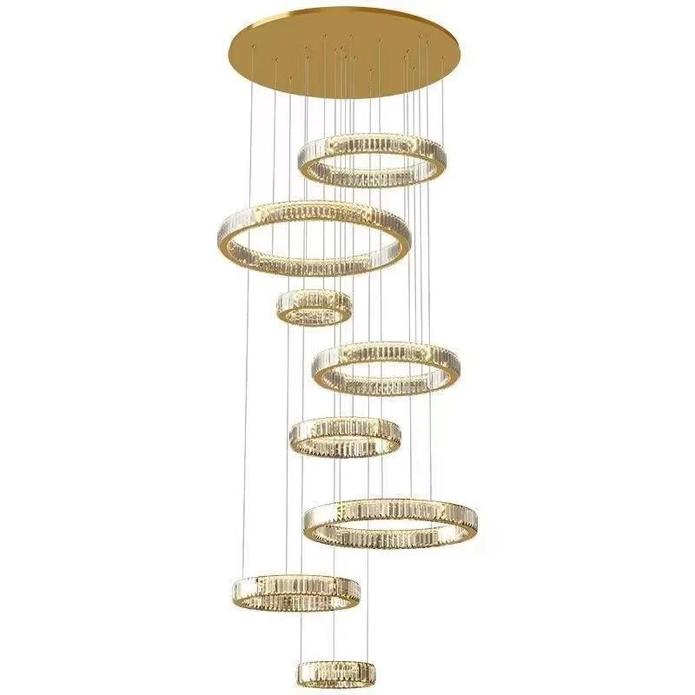 This is a luxury multi-layer circular crystal chandelier, with a golden base and staggered hanging crystal ring lamp bodies. It features a luxurious and grand design, shining brightly under light. It is used for space lighting and decoration, creating a high-end and luxurious ambiance. It is suitable for double-height living rooms in villas, lobbies of high-end hotels, luxury clubs and other places.