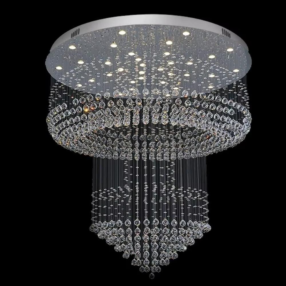 This is a multi-layered cascading crystal ceiling light, composed of numerous stacked crystal beads and components. It has a three-dimensional and layered shape, translucent and brilliant under light. It is used for space lighting and luxurious decoration, combining practicality and artistry to significantly enhance the space’s grade. It is suitable for high-end hotel lobbies, luxury villa living rooms, large banquet halls and other high-end places.