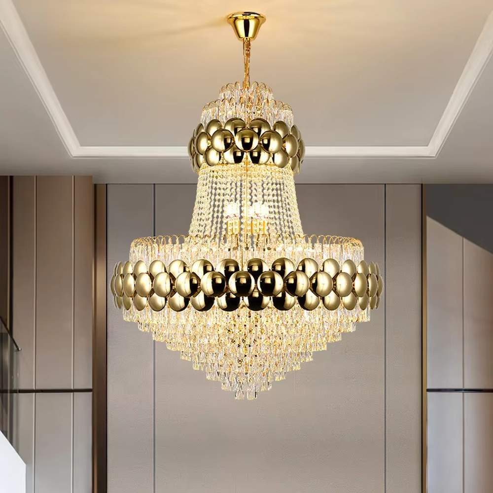 This is a luxurious multi-layer golden ball crystal chandelier, featuring a multi-layer structure combining golden metal balls and crystals. When lit, the light is brilliant and gorgeous, creating a high-end luxurious space atmosphere.