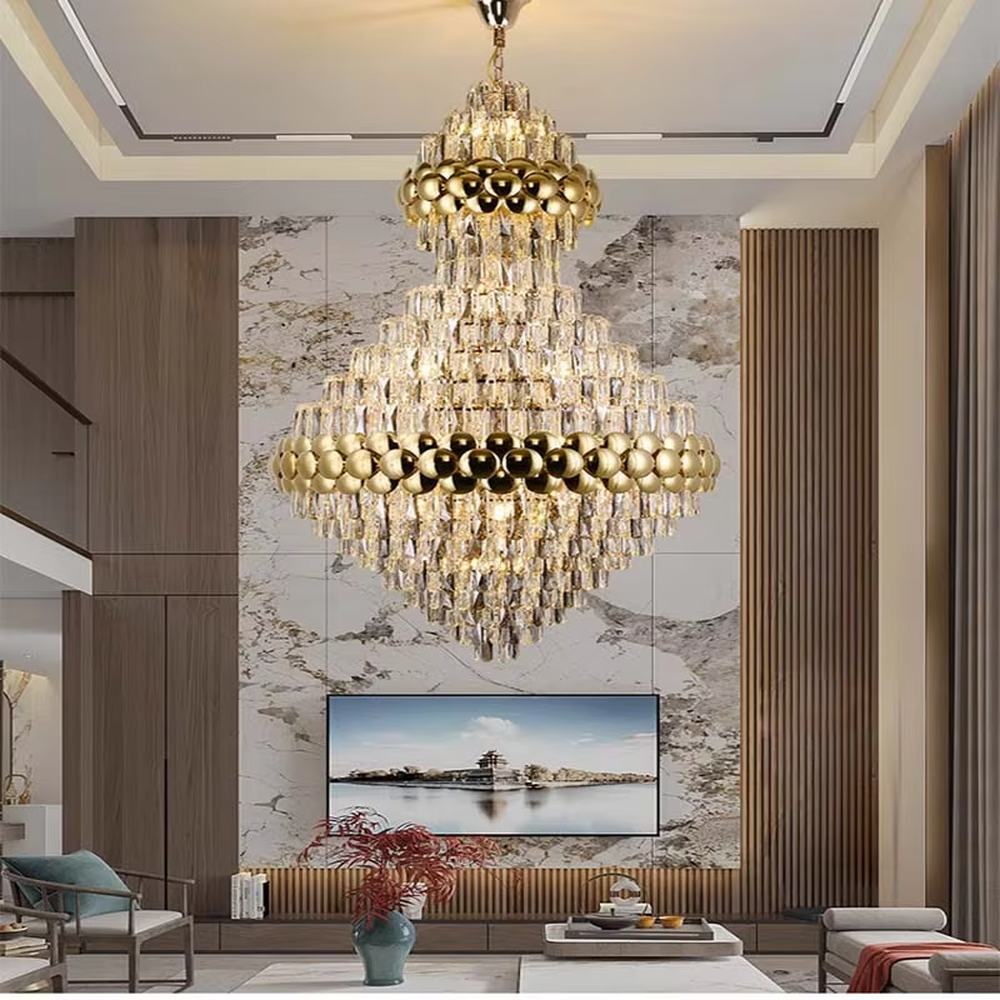 This is a luxurious double-layer crystal golden ball chandelier, featuring a golden metal frame paired with transparent crystals and golden spherical decorations, with a double-layer hierarchical design. It has a magnificent and grand style, with brilliant and soft lighting, creating a high-end luxurious atmosphere.