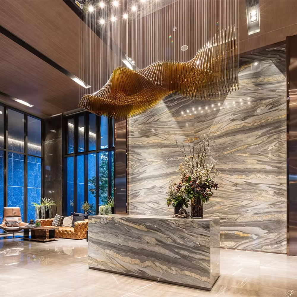 This is a modern artistic large wave-shaped metal art chandelier, with golden metal strips forming a three-dimensional wave shape, suspended by multiple thin wires. It features strong artistic tension and spatial decorativeness, with brilliant and grand lighting. It is used for space lighting and artistic installation decoration, creating a high-end artistic and luxurious atmosphere. Suitable for high-end hotel lobbies, luxury commercial clubs, art exhibition halls and other places.