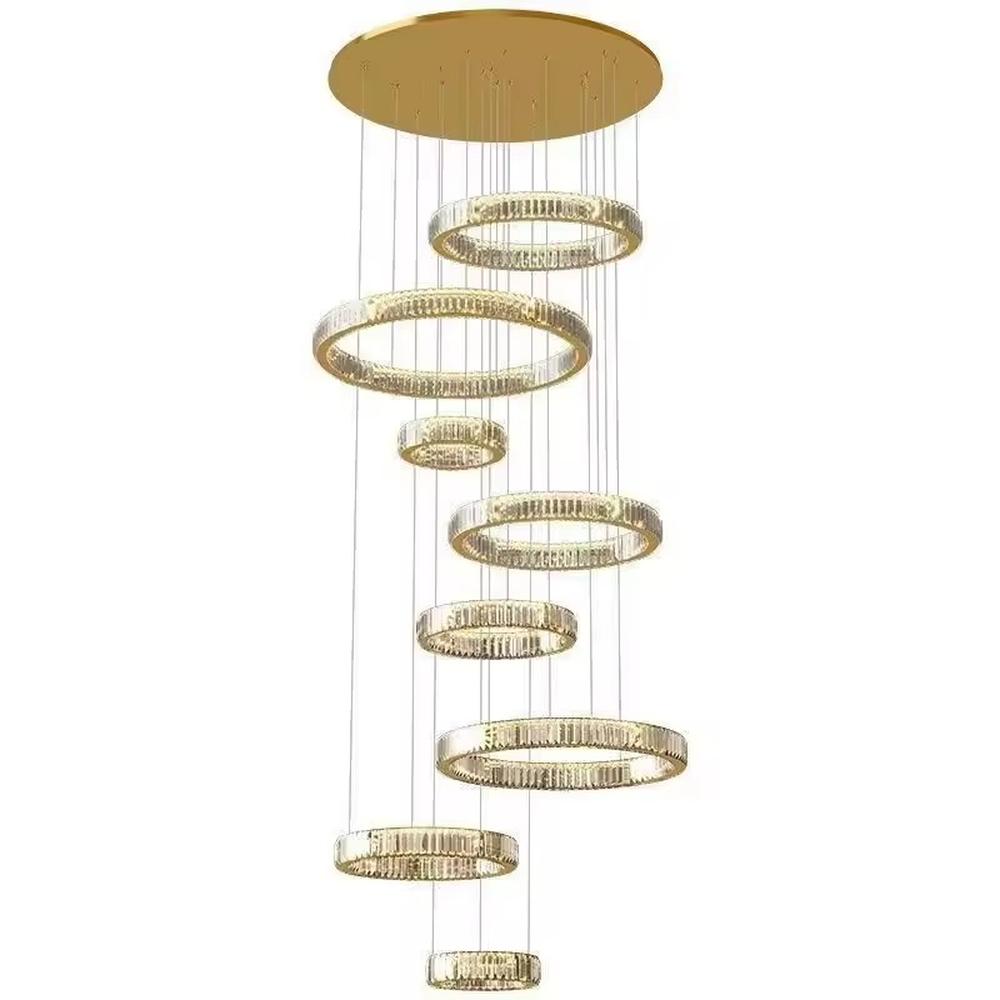 This is a luxury multi-layer circular crystal chandelier, with a golden base and staggered hanging crystal ring lamp bodies. It features a luxurious and grand design, shining brightly under light. It is used for space lighting and decoration, creating a high-end and luxurious ambiance. It is suitable for double-height living rooms in villas, lobbies of high-end hotels, luxury clubs and other places.
