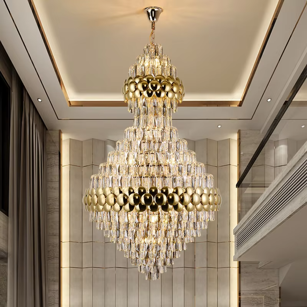 This is a luxurious double-layer crystal golden ball chandelier, featuring a golden metal frame paired with transparent crystals and golden spherical decorations, with a double-layer hierarchical design. It has a magnificent and grand style, with brilliant and soft lighting, creating a high-end luxurious atmosphere.