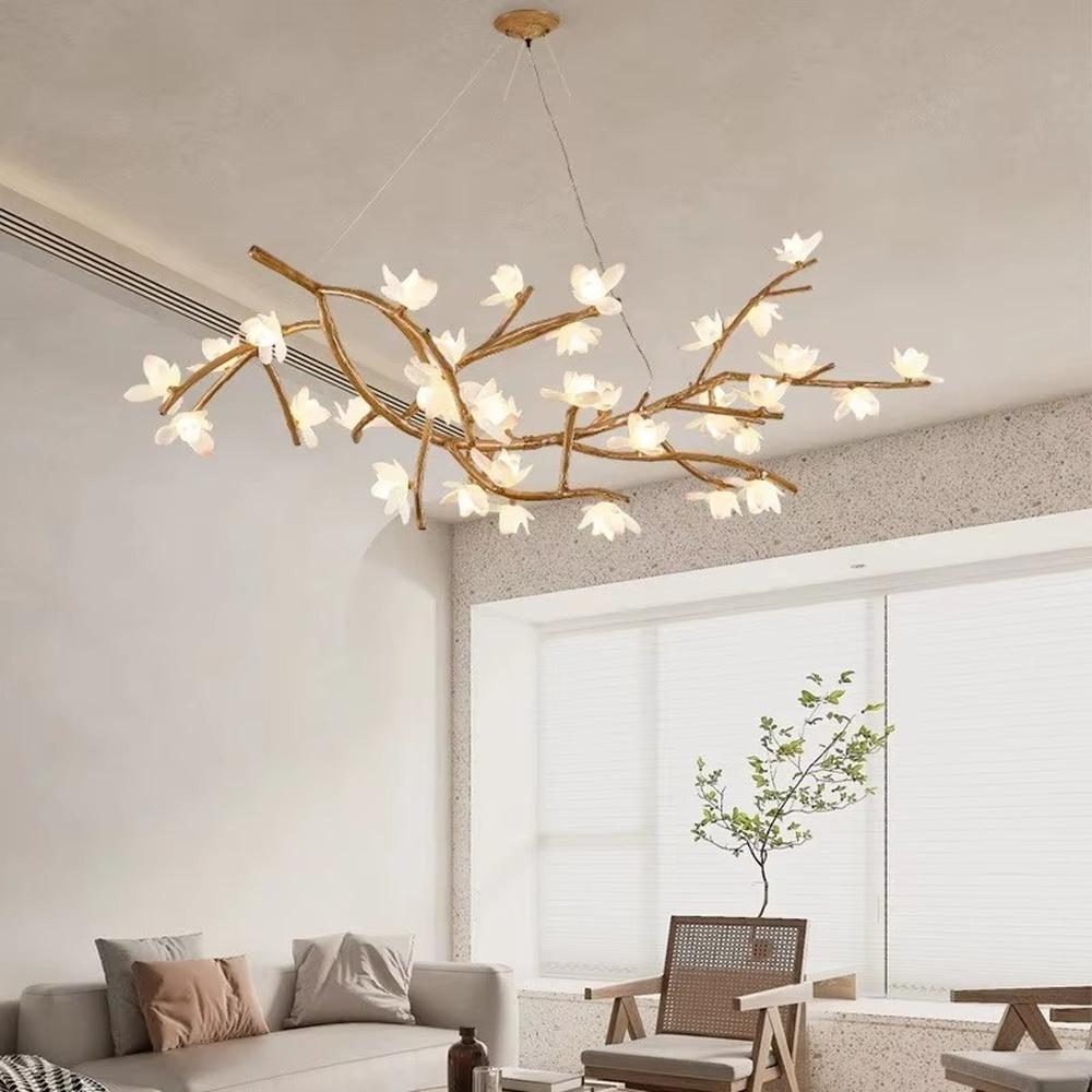 This is a natural artistic branch-shaped chandelier with a golden branch-like frame and multiple spherical lampshades, featuring a natural and flexible design with artistic sense. It is used for space lighting and decoration, creating a natural luxury atmosphere. It is suitable for Nordic-style home living rooms, art homestays, creative studios and other places.