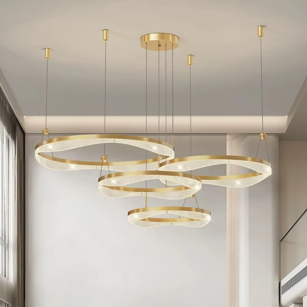 This is a modern luxury multi-layer circular chandelier, with golden metal circular frames hanging in a scattered manner, featuring artistic layers and strong luxury sense. It is used for space lighting and decoration, creating a high-end artistic atmosphere. It is suitable for high-ceilinged living rooms, high-end hotel lobbies, modern art exhibition halls and other places.