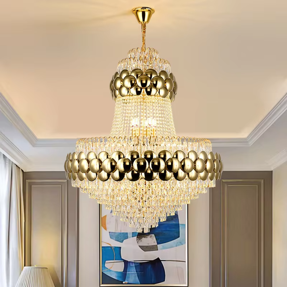 This is a luxurious multi-layer golden ball crystal chandelier, featuring a multi-layer structure combining golden metal balls and crystals. When lit, the light is brilliant and gorgeous, creating a high-end luxurious space atmosphere.