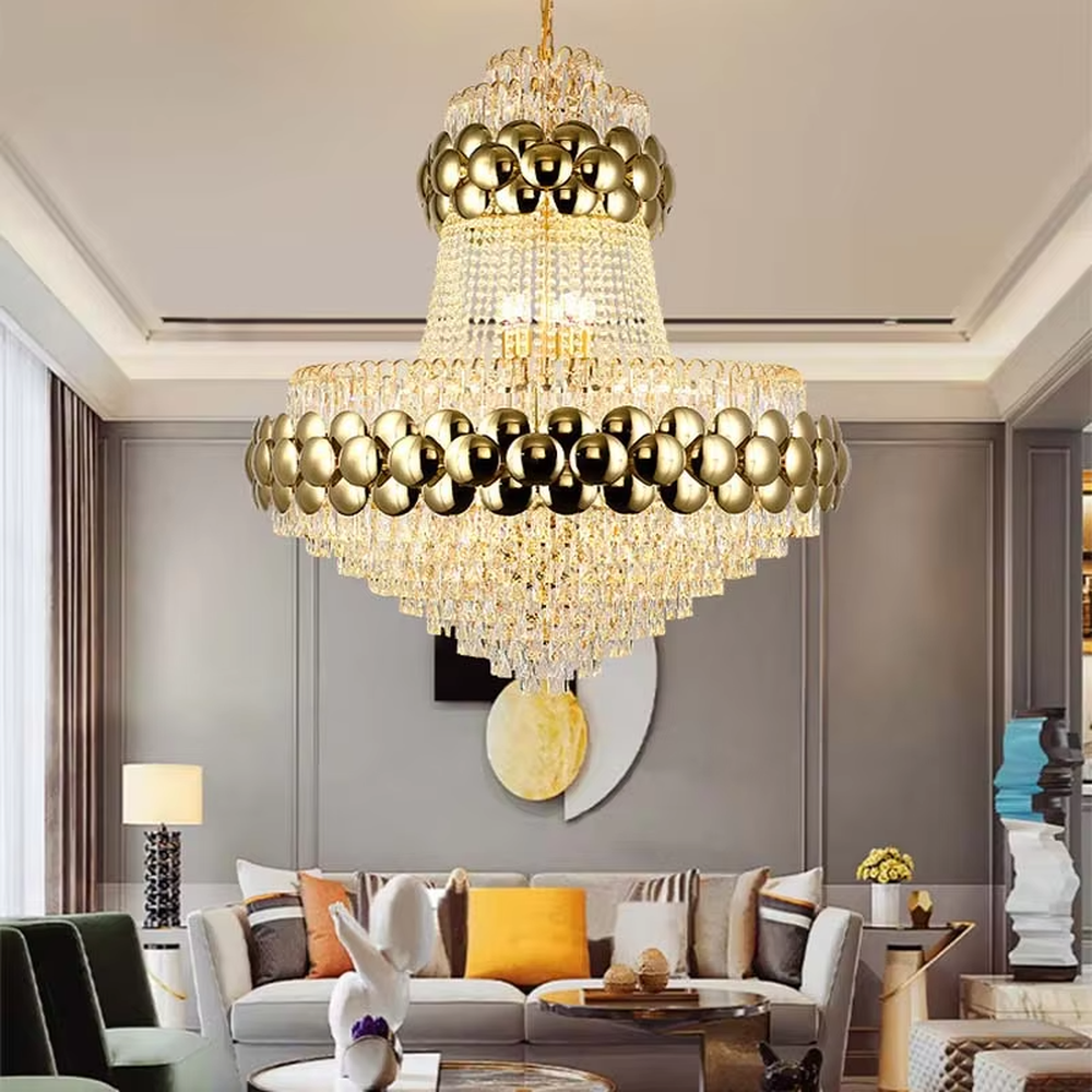 This is a luxurious multi-layer golden ball crystal chandelier, featuring a multi-layer structure combining golden metal balls and crystals. When lit, the light is brilliant and gorgeous, creating a high-end luxurious space atmosphere.