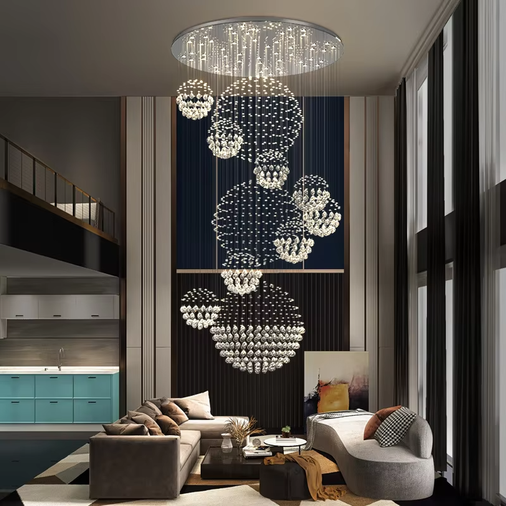 This is a modern luxurious multi-layer spherical crystal chandelier, composed of multiple transparent crystal balls forming spherical structures hung in layers. It features strong artistic sense and spatial decorativeness, with brilliant and grand lighting. It is used for space lighting and artistic decoration, creating a luxurious and high-end atmosphere. Suitable for high-ceiling lobbies of high-end hotels, double-height living rooms in luxury villas, large art exhibition halls and other places.