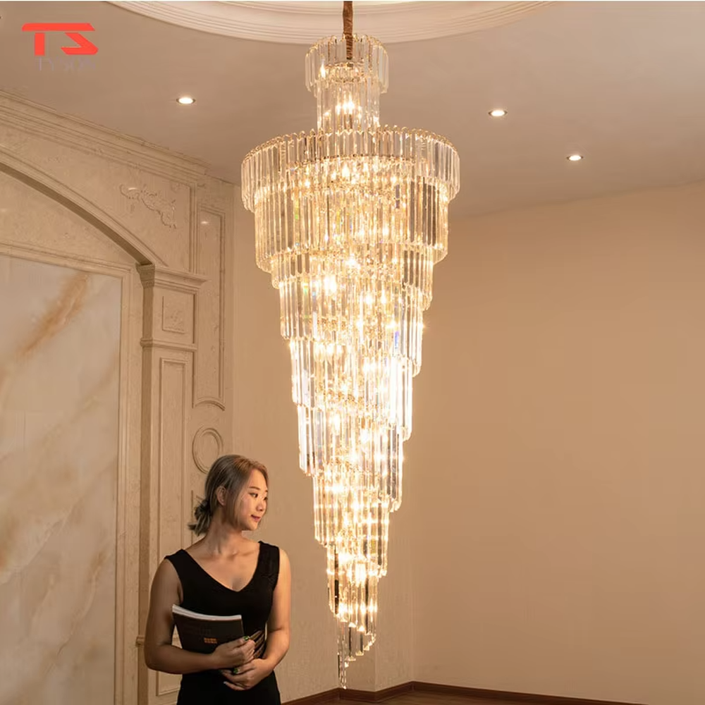 Top-tier luxurious multi-layer crystal column high-ceiling chandelier, stacked transparent long crystal columns + brilliant refraction light effect, creating a noble luxurious high-ceiling space atmosphere.