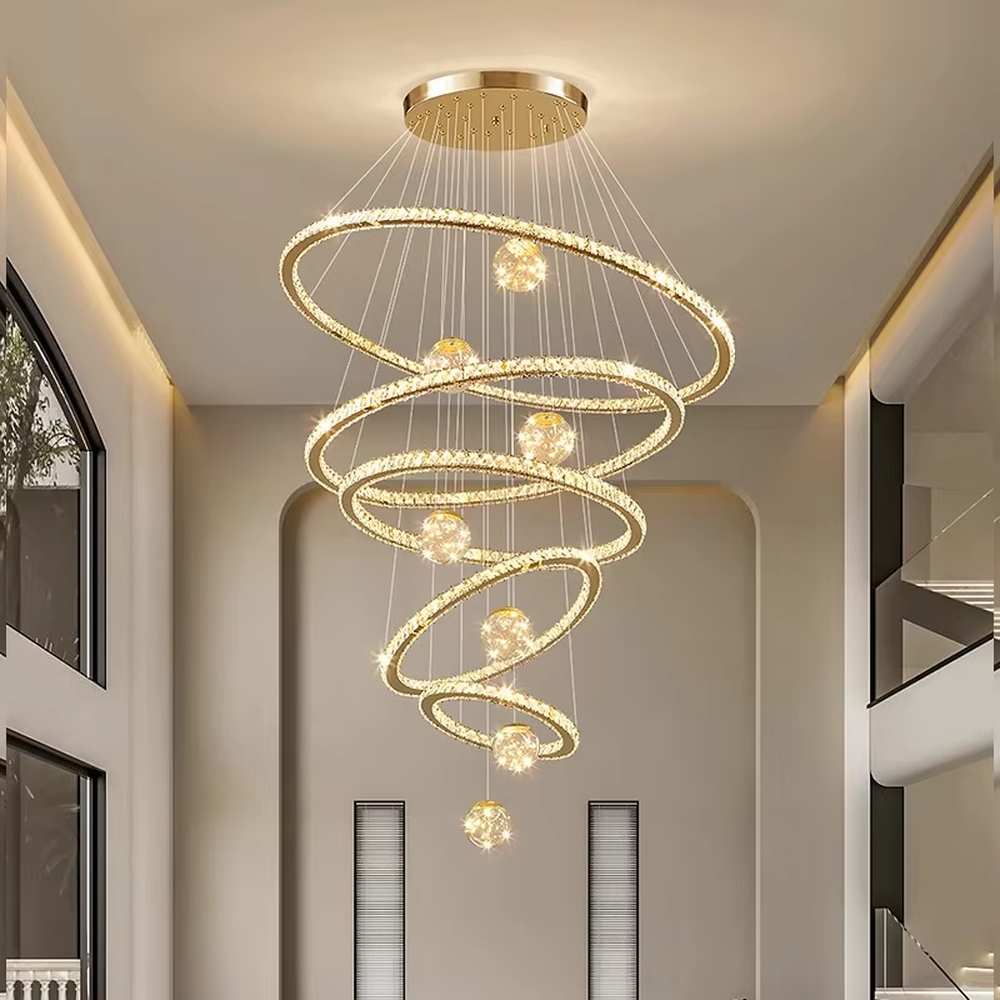 Modern top-luxury spiral ring crystal high-ceiling chandelier, golden frame + full crystal ring inlay + crystal light ball decoration + warm light effect, creating a luxurious artistic atmosphere in high-ceiling spaces.