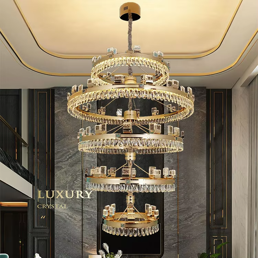 Top-luxury modern multi-layer ring crystal chandelier, golden frame + full crystal inlay + square decorations, brilliant warm light creates luxurious atmosphere in high-ceiling spaces.