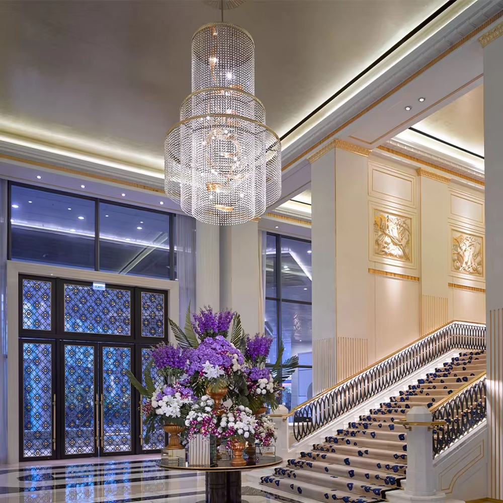 Luxury multi-layer crystal chandelier (spiral gold accessories + full-set crystals), warm light effect, creating a luxurious and elegant high-end space atmosphere.