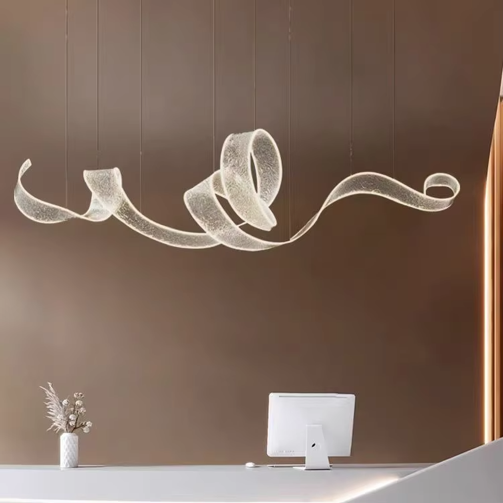 Art ribbon curve chandelier (transparent texture acrylic + flowing shape), warm light effect, creating a minimalist artistic space atmosphere.