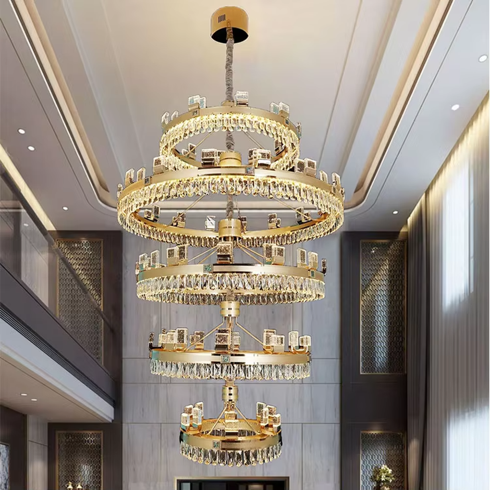 Top-luxury modern multi-layer ring crystal chandelier, golden frame + full crystal inlay + square decorations, brilliant warm light creates luxurious atmosphere in high-ceiling spaces.