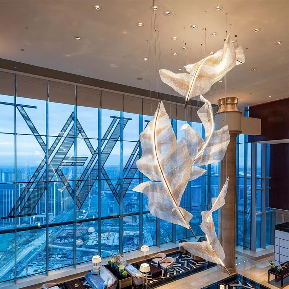 Art feather crystal chandelier (giant crystal feather shape), warm light effect, creating an ethereal and luxurious high-end space atmosphere.